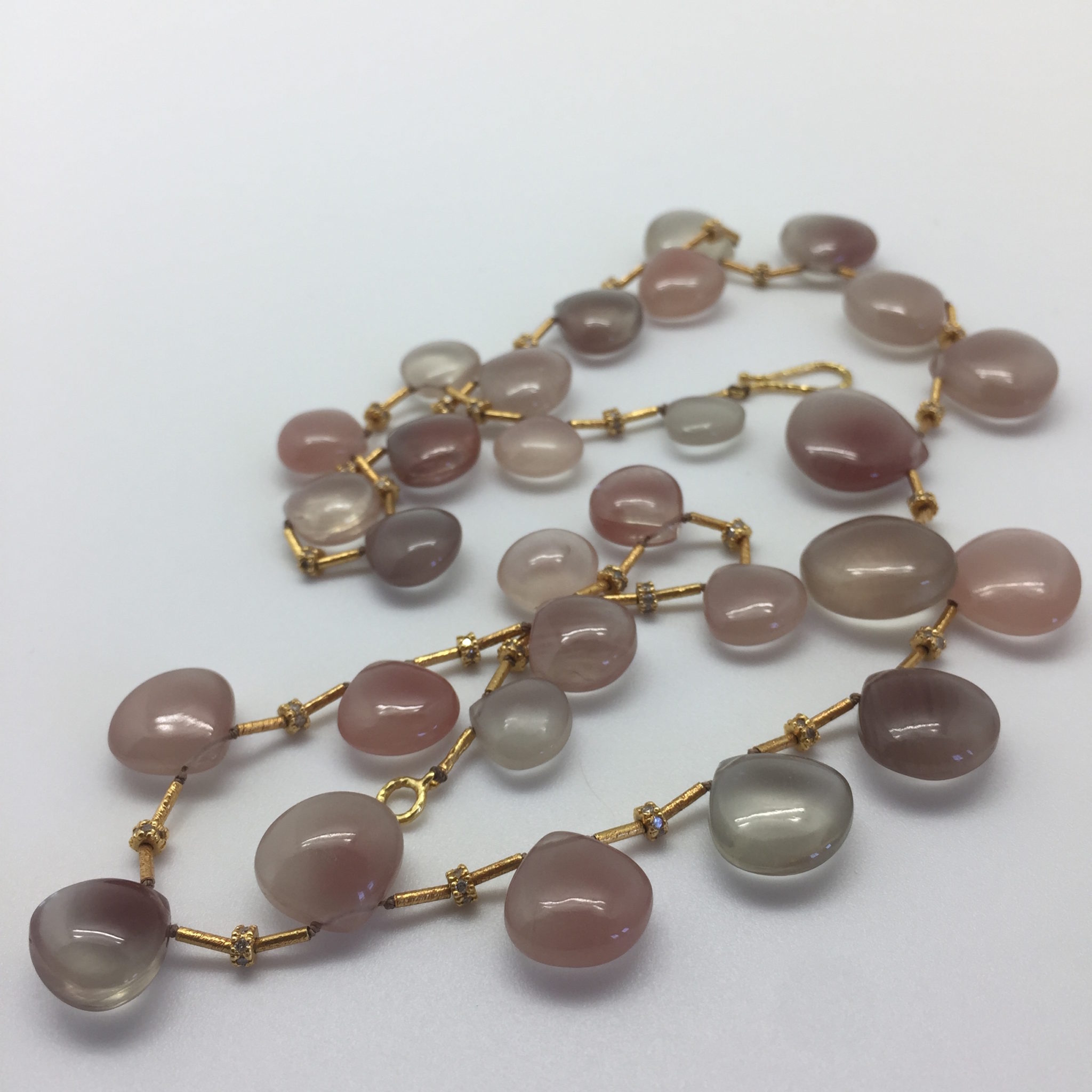 Daydreaming in Sunstones: Sunstone necklace of opaque smooth clam-shaped briolettes spaced with 18K gold tubes and 14K rondelle beads studded with diamonds. Item N00006 detail photo 05
