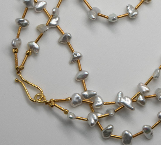 closeup of Japanese Keshi pearls with 18K gold hook & eye clasp