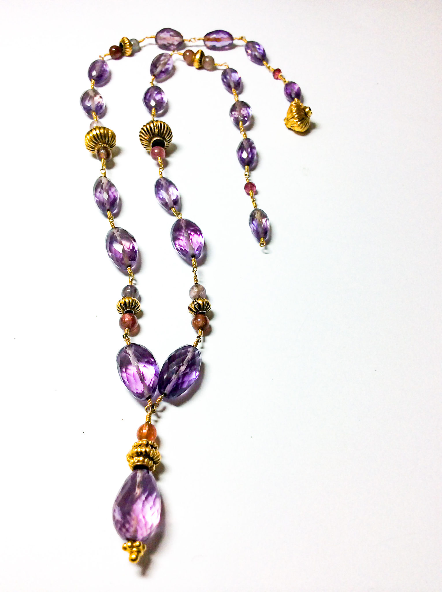 amethyst necklace of faceted beads, spinels and high karat gold