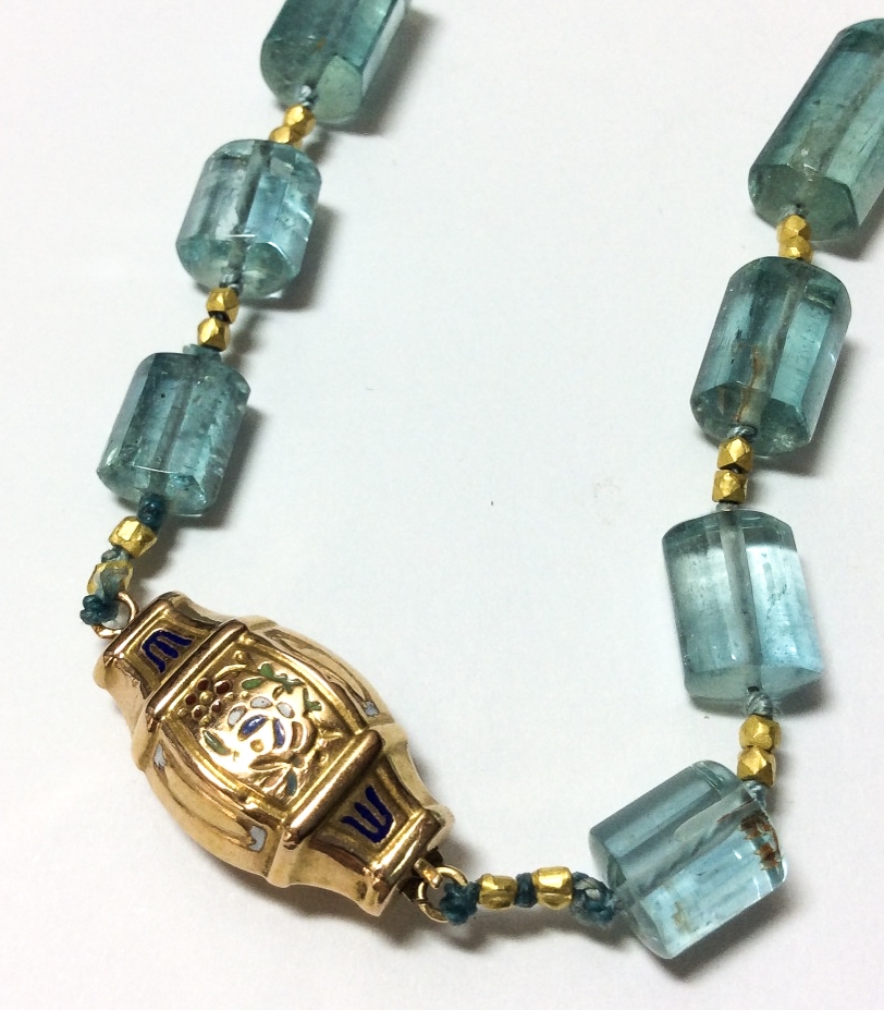 detail of antique 18K gold enameled clasp on aquamarine crystal necklace
