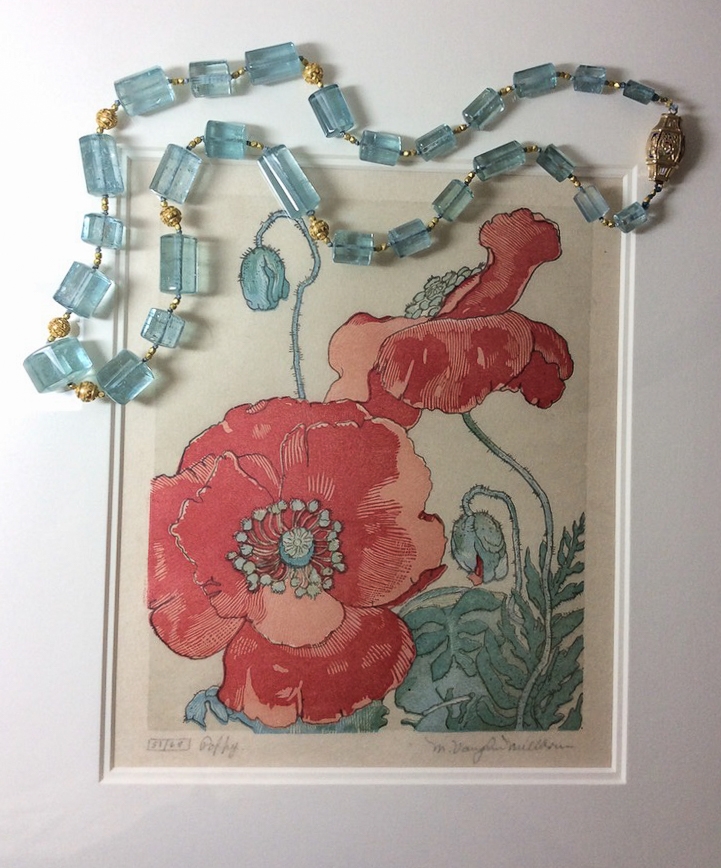 polished aquamarine crystal necklace with Bali granulated 20K gold beads are photographed on an 18th century woodblock print of poppies