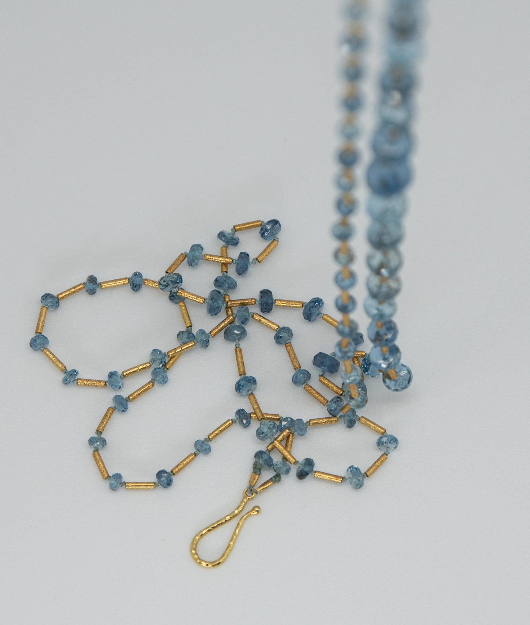 double-strand of delicate faceted aquamarines spaced with 18K Turkish gold tubes