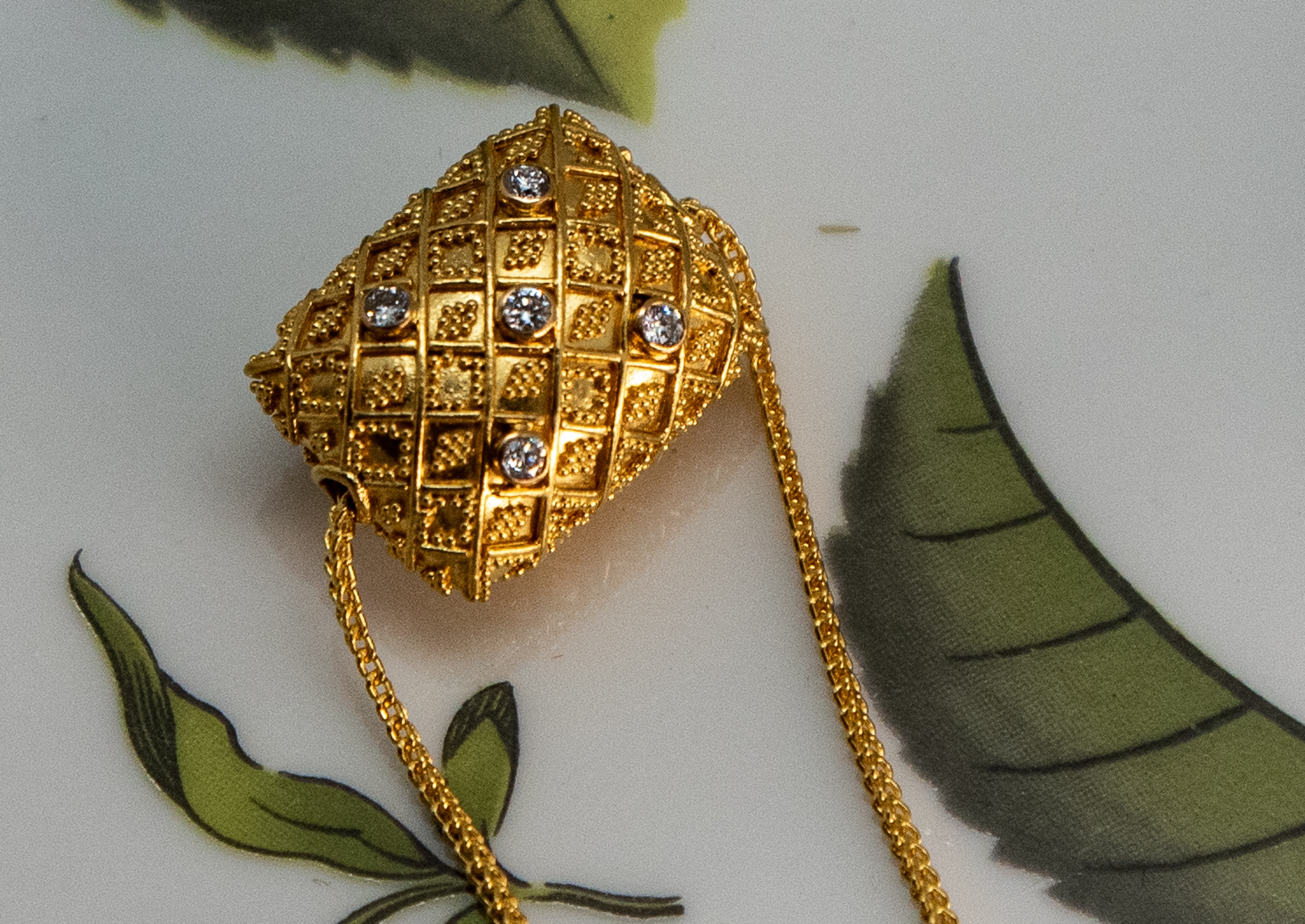 22K Balinese gold pillow shaped bead with fancy granulation and diamonds on a matching 22K gold chain