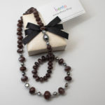Chocolate Moonstone Necklace with Pearls, photograph showing 13mm Tahitian pearl clasp and bento presentation box