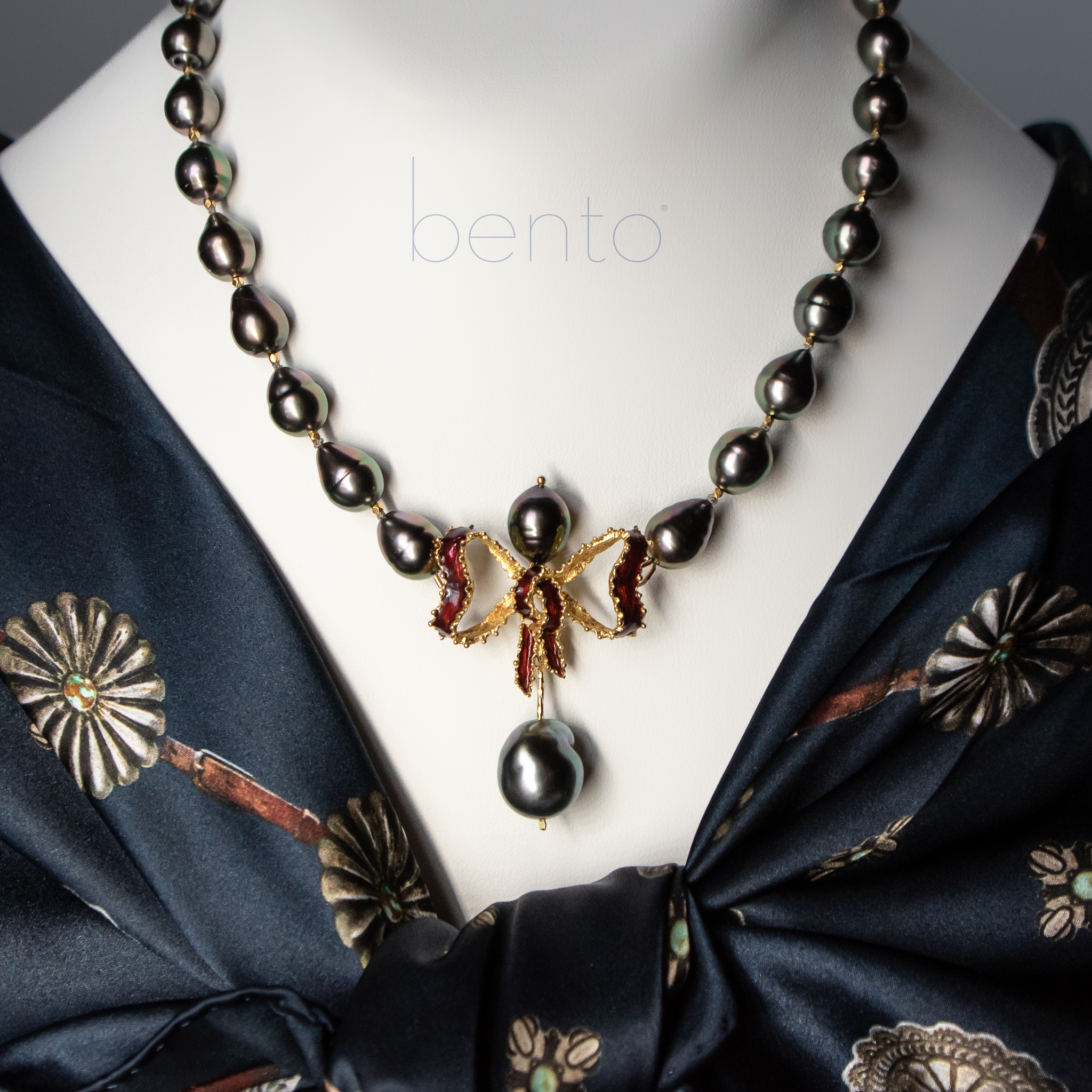 Tahitian gray pearl necklace with peacock overtones and Italian 18K gold enameled bow pendant