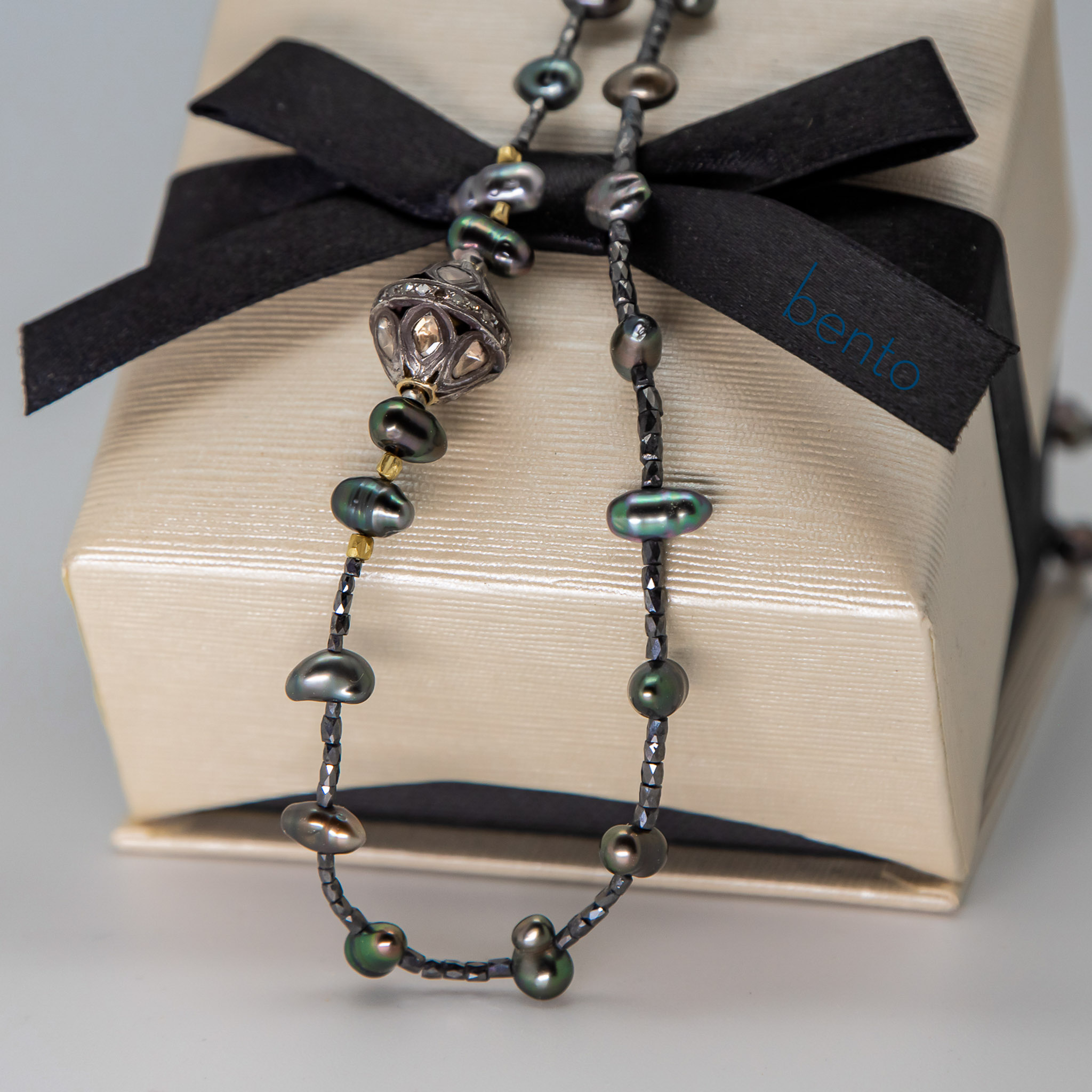 gift box with Tahitian pearl and black diamond faceted bead necklace with sterling silver and diamond slice clasp