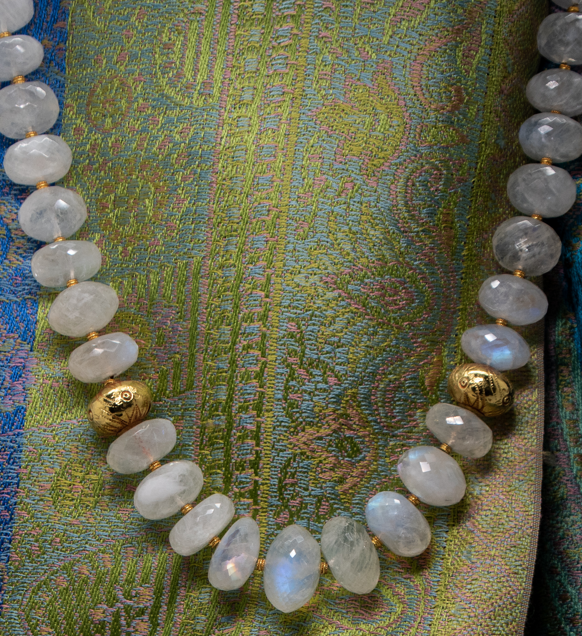 Closeup of vintage India 20K gold wax beads on moonstone necklace