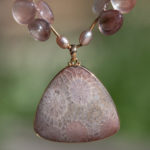 closeup of 18K fossil coral pendant