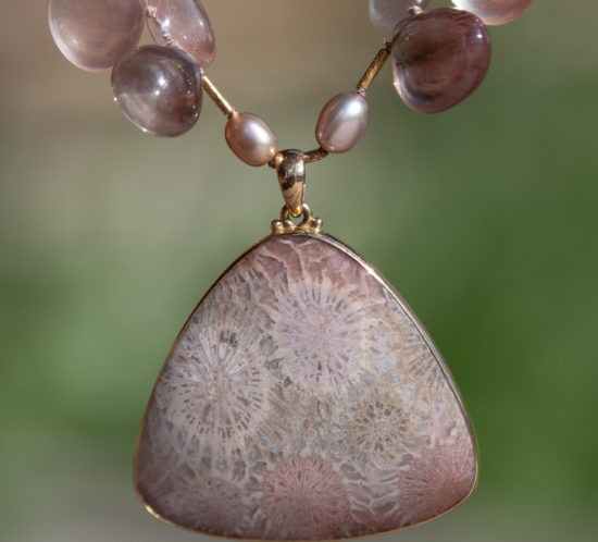 closeup of 18K fossil coral pendant