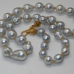 Silvery South Sea pearl necklace with 22K gold clasp and spacers
