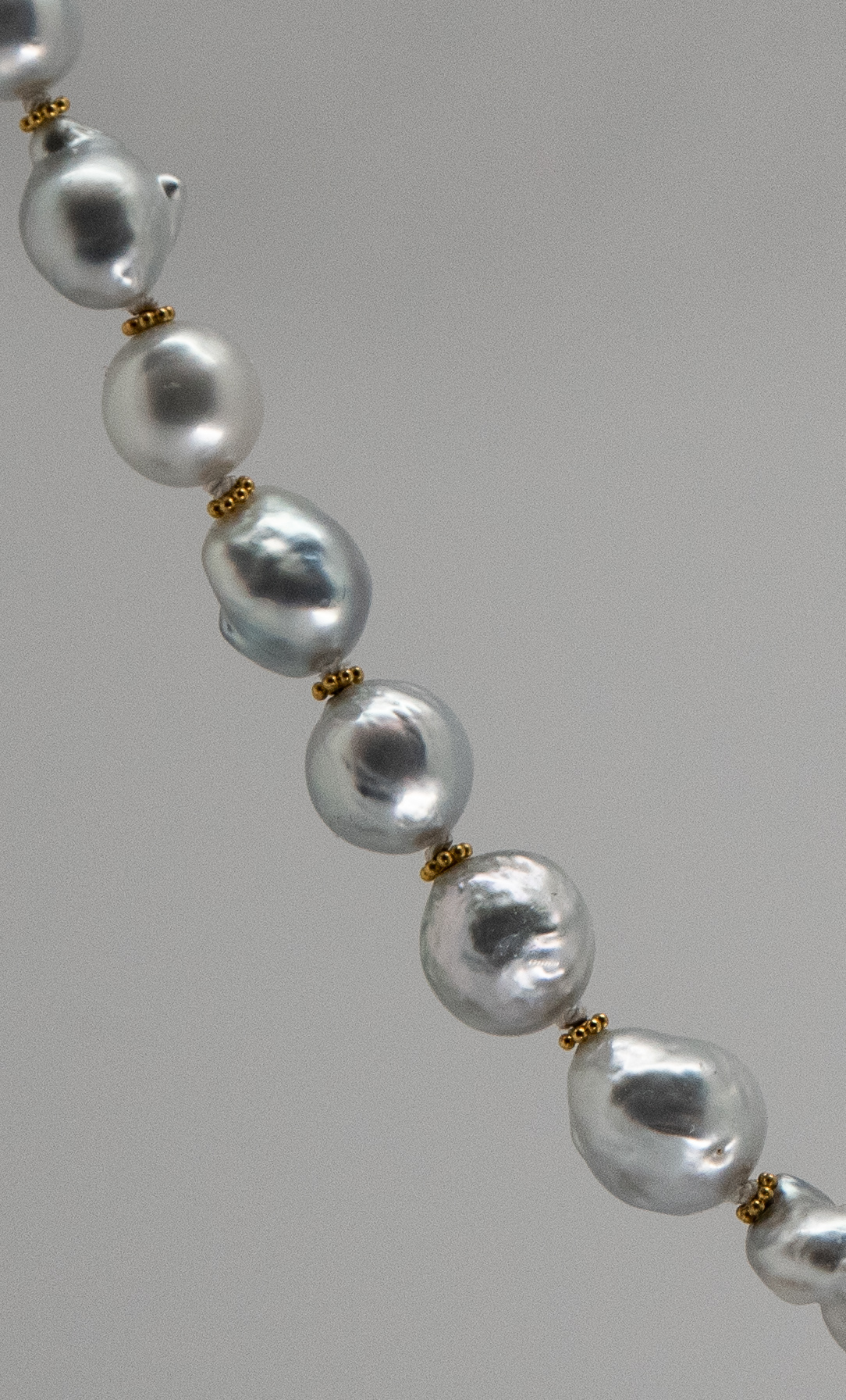 detail of south sea pearl necklace showing knotting and 22K gold spacers