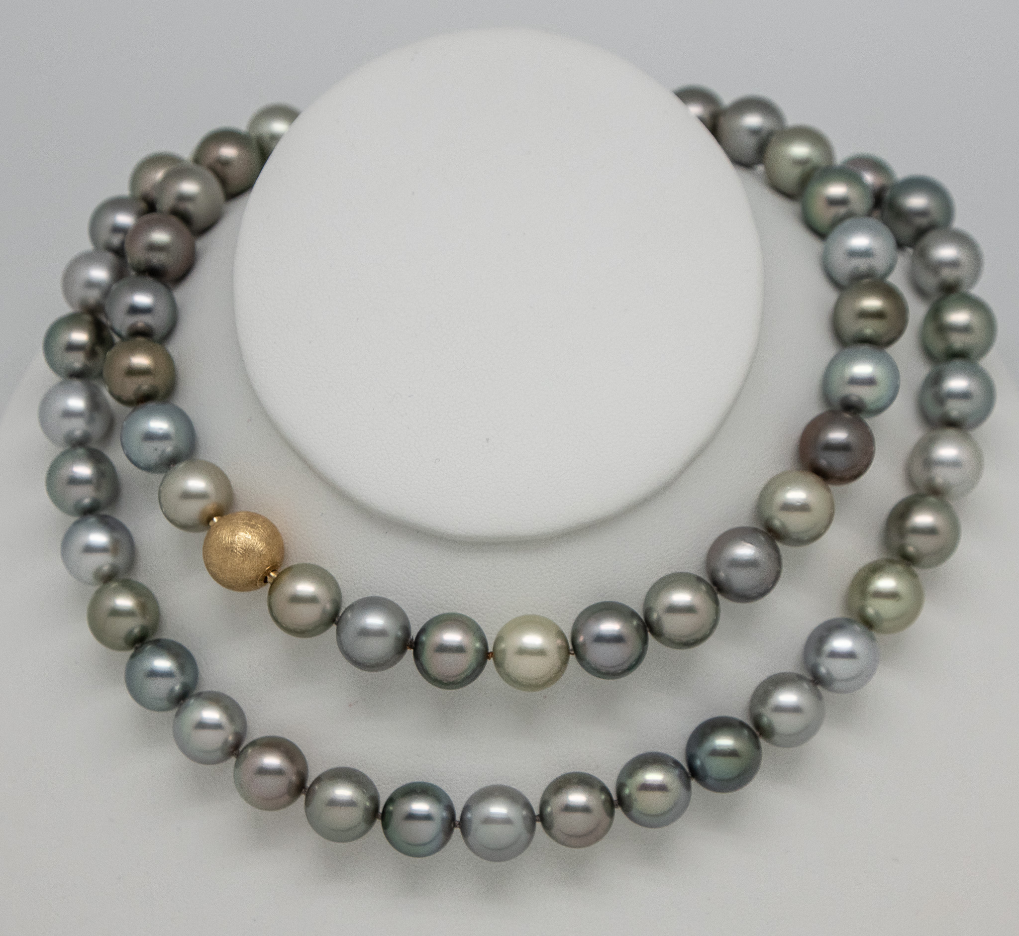 Closeup photo of 12.5mm Tahitian pearl necklace wrapped twice for a double strand look.