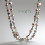 Close-up of Brazilian tourmaline cabochon beads with freshwater pearls necklace