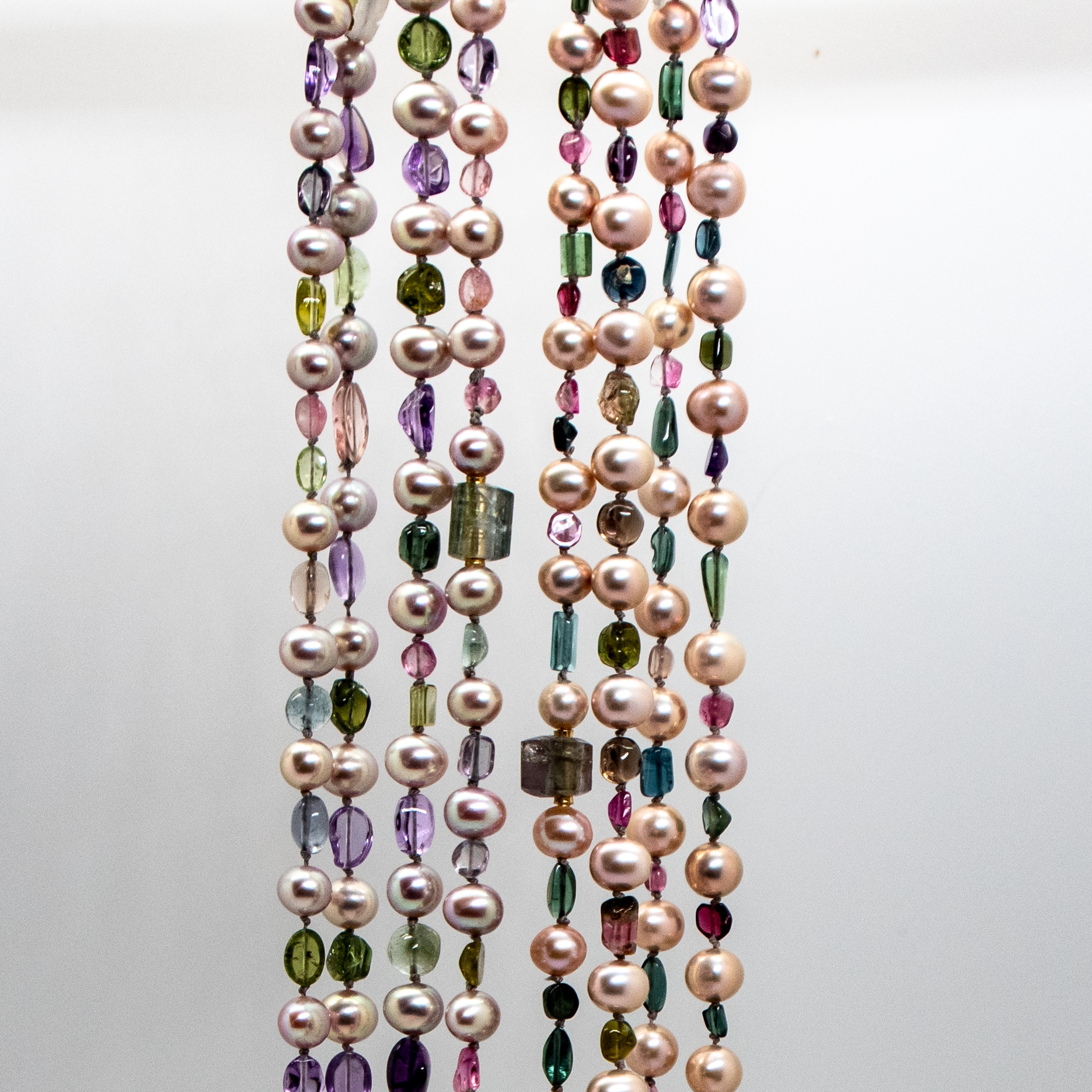 full length view of two tourmaline and freshwater pearl necklaces - top
